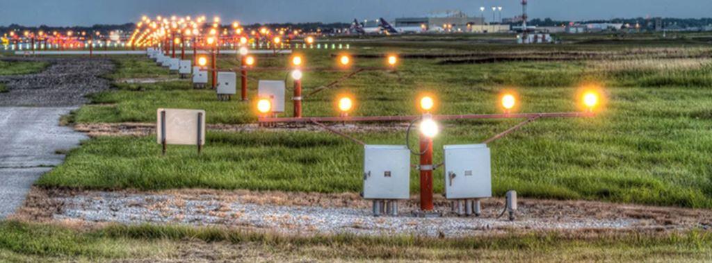 Picture of Airport Client's Airfield Well Manicured Turf Grass and Herbicide Chemical Trim around Gravel and Fixtures