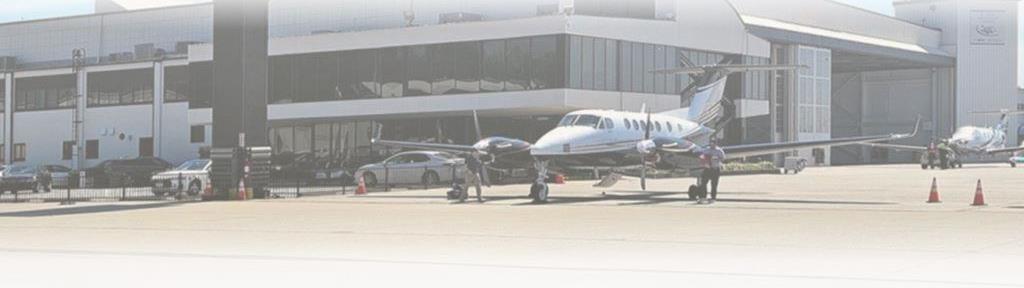 airplane parked at municipal airport in Atlanta Georgia with no vegetation in pavement cracks thanks to VegClear