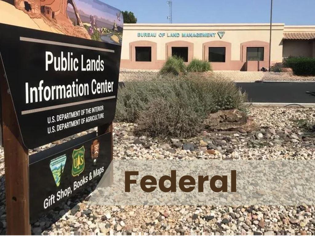 A government building with well-kept grounds and clear access paths, reflecting trusted vegetation management practices.