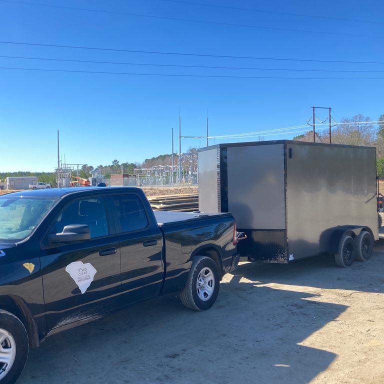 VegClear truck and enclosed spray trailer staged at an electrical substation site, supporting industrial vegetation management operations on gravel non cropland utility property in South Carolina.