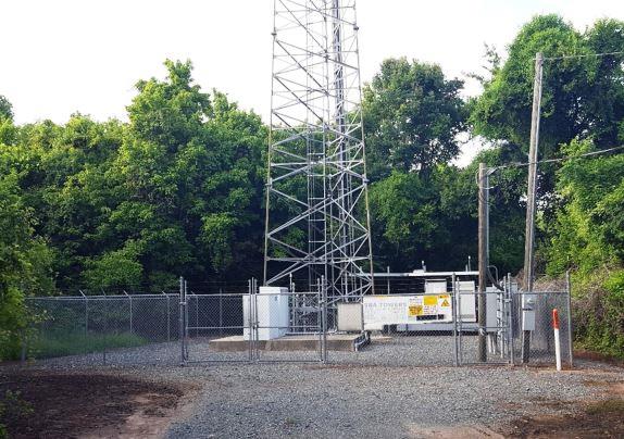 Gravel Site with Runoff Rainwater Entering Upstream: Industrial Property Cell Tower Base on Commercial Property