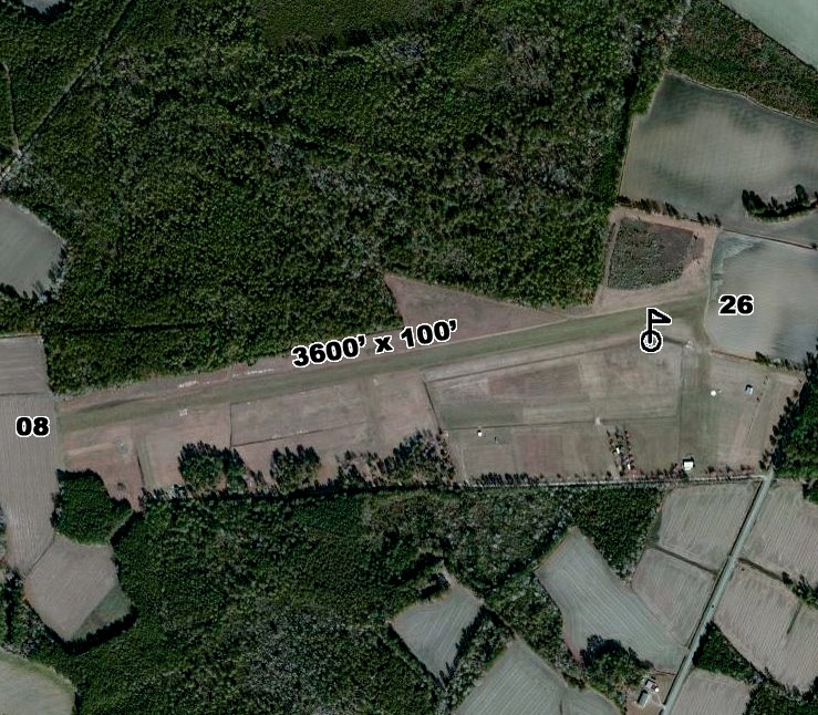 Large industrial fuel storage tanks with connected rail terminal. Image shows clean gravel and minimal vegetation due to effective weed control measures.