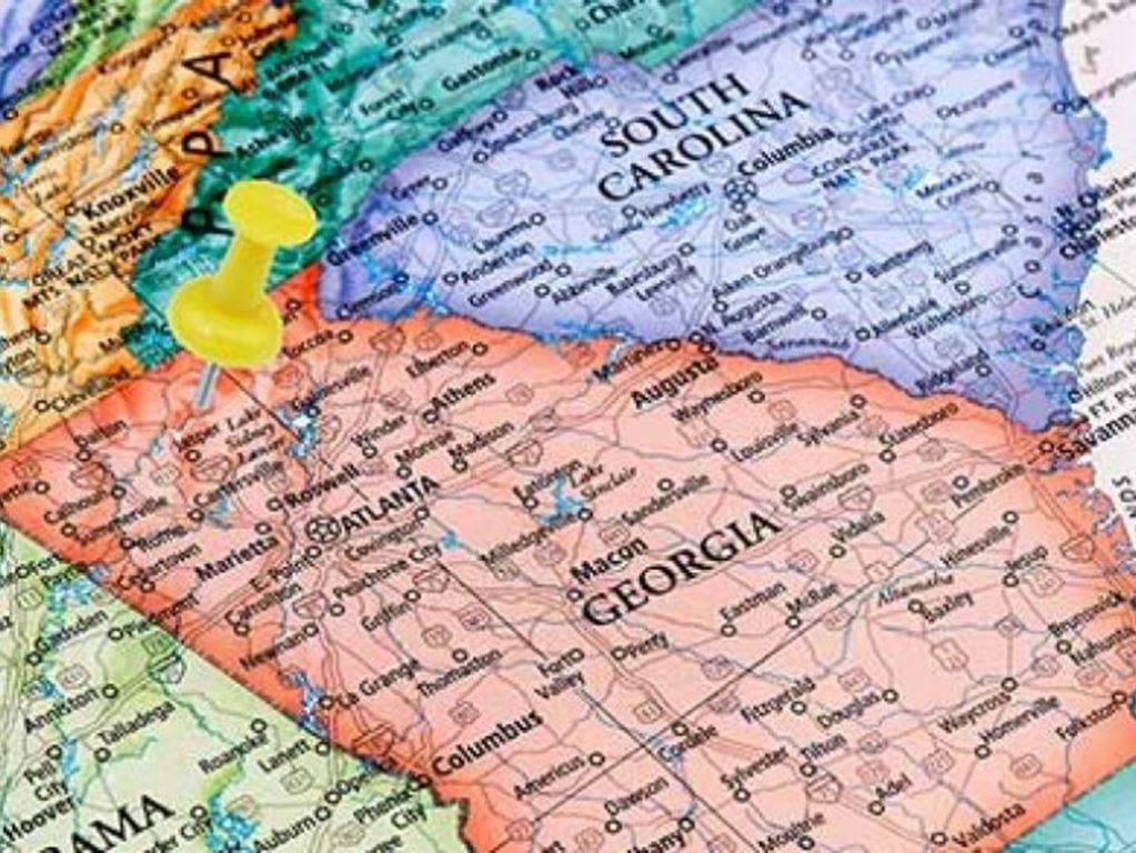 Map of Georgia highlighting Forsyth County with a yellow push pin marking the north Atlanta metro area, representing the industrial corridor between Georgia and South Carolina along with the surrounding Southeast region where VegClear provides industrial vegetation management and kudzu control services