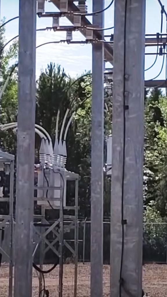 Treated switching station showing clear, vegetation-free ground between equipment rows.