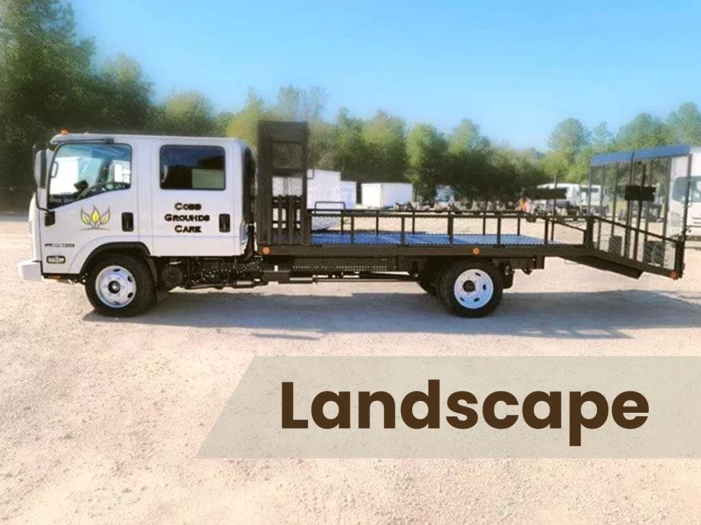 Landscapers working on a project with clear areas around plant beds, demonstrating expert herbicide treatments.