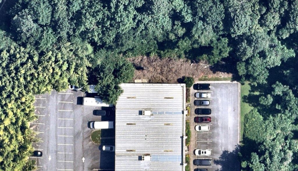 Parking Lot crack weeds, area surrounding the building and loading dock using industrial herbicide so workers see and maintain it as needed. controlling shrubs, plants, vines, and trees away from pavement and fenced areas