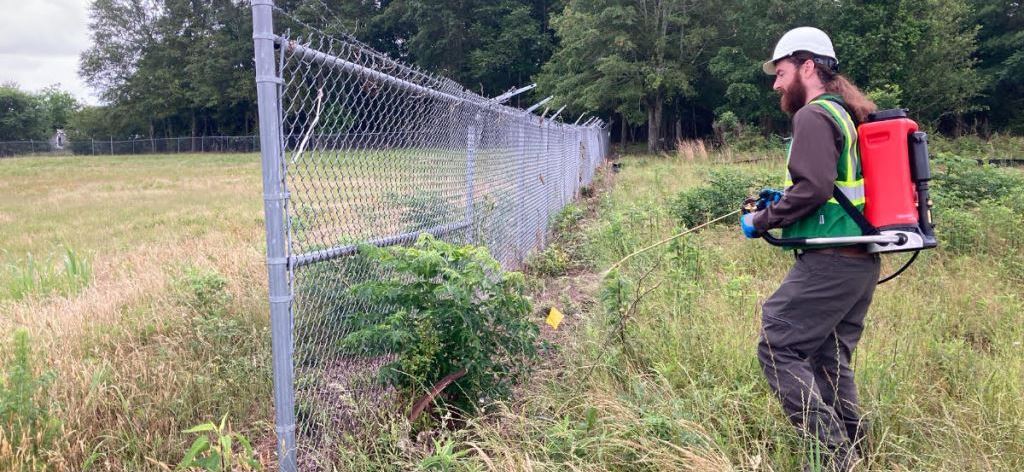 Vegclear roadside spray with herbicide tanks and mounted nozzles for utilities guardrail and parking lot right of way