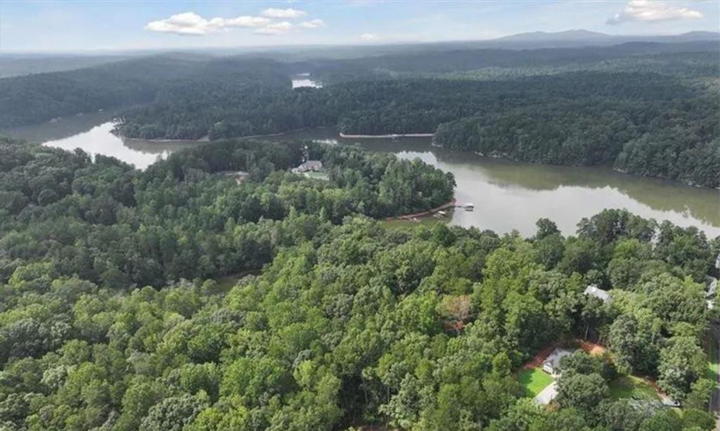Aerial view of Lake Lanier, Georgia, with forested shoreline, winding coves, and calm waters highlighting the reservoir’s scale and natural beauty.