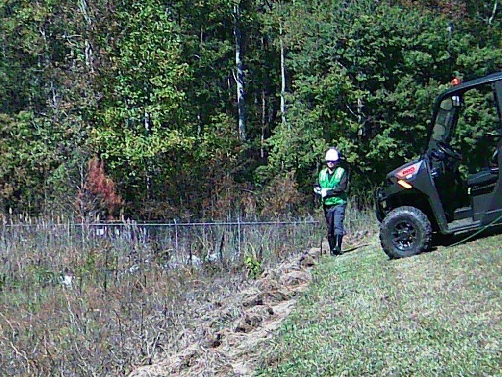 VegClear technician performing slope and perimeter vegetation control at an industrial site, supporting safe access and long term weed management in a documented case study.