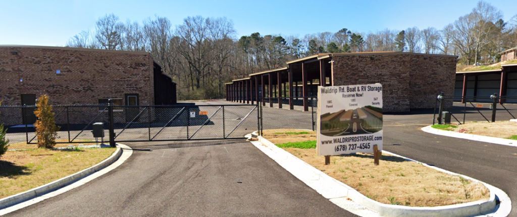 Front entry of self-storage RV & Boat facility sprayed to prevent broadleaf and trees to implement program controlling weeds in immediate area to remain protected from vegetation