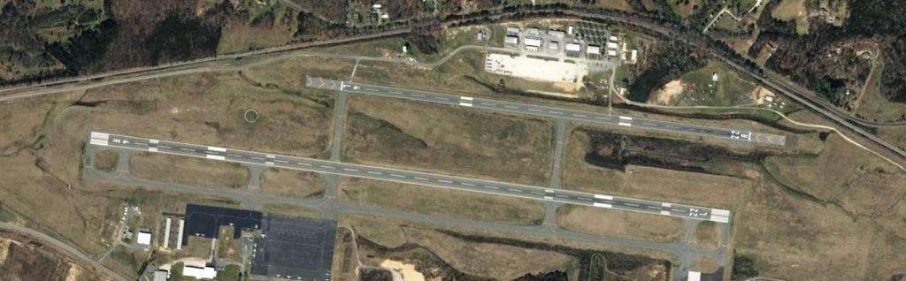 Commercial airport runway with clear vegetation control along edges, ensuring safe aircraft operations and compliance. VegClear provides licensed herbicide application and vegetation management for airports in Georgia and the Southeast, focusing on fire risk reduction, visibility, and infrastructure protection.