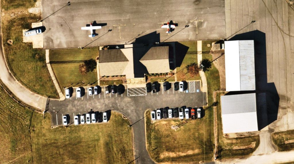 Overhead view of Greene County Airport in Georgia showing hangars, FBO, and apron area featured in VegClear’s airport vegetation control case study.