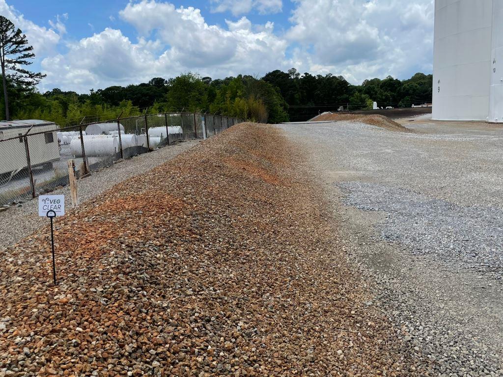 Bare Ground Gravel Entrance After Vegetation Treatment on Industrial Site in Georgia