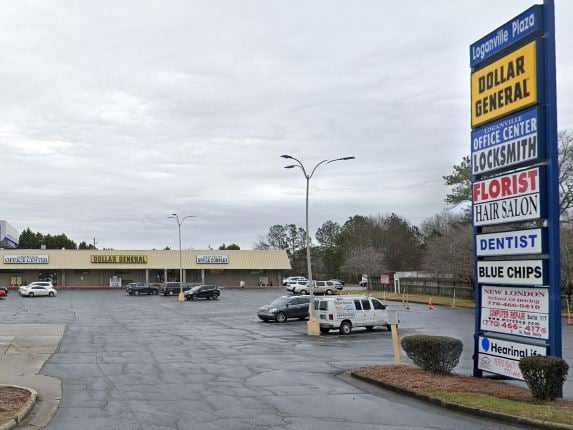 Loganville Plaza in Walton County, GA featuring Dollar General and retail shops, linking to VegClear’s pavement crack weed control case study