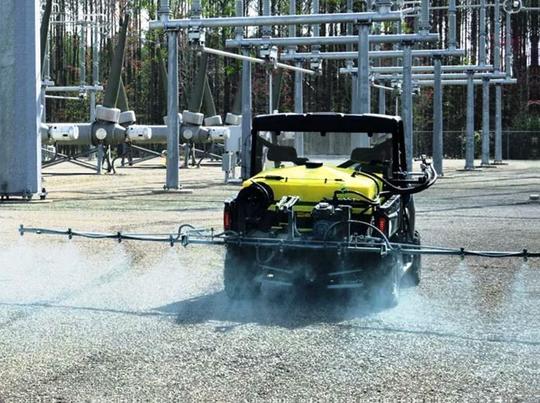 ATV with Boom Sprayers Treating Weeds at Power Substation